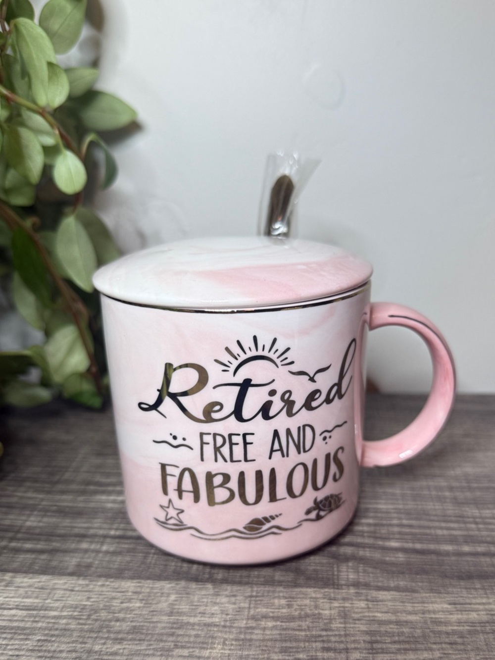 Penny Cai pink marble mug with lid and spoon.